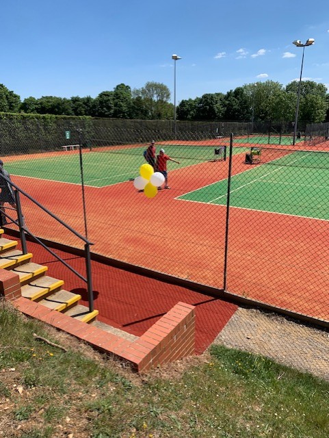 The newly resurfaced tennis court with decorations for grand opening event