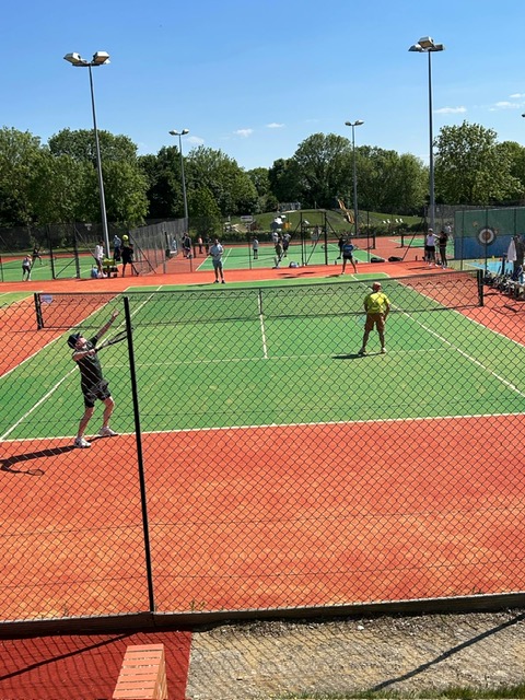 Community members enjoying a game on newly resurfaced tennis courts after tennis court resurfacing at Greenwood Park LTC