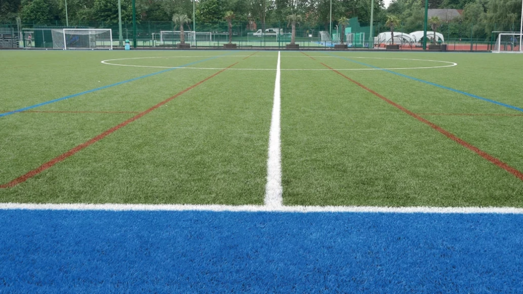 Ground level view of 3G pitch with a blue and white stripe